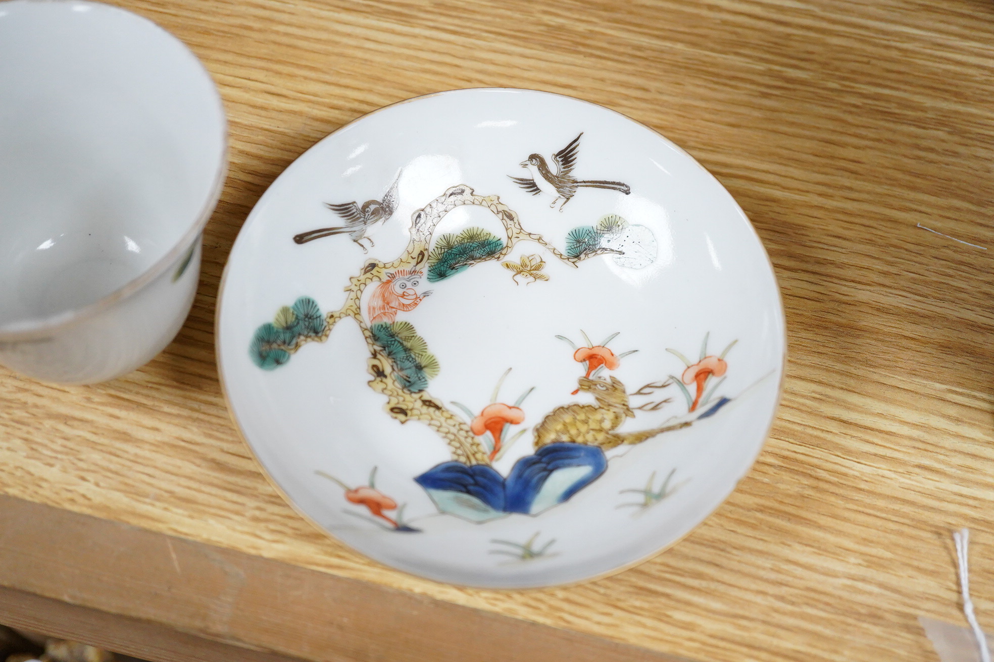 A Chinese cup and stand, 8cm high